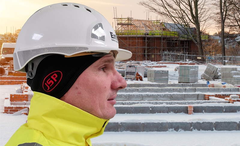 Male wearing thermal beanie under hard hat in cold weather