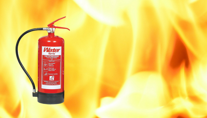 Water fire extinguisher on flame background